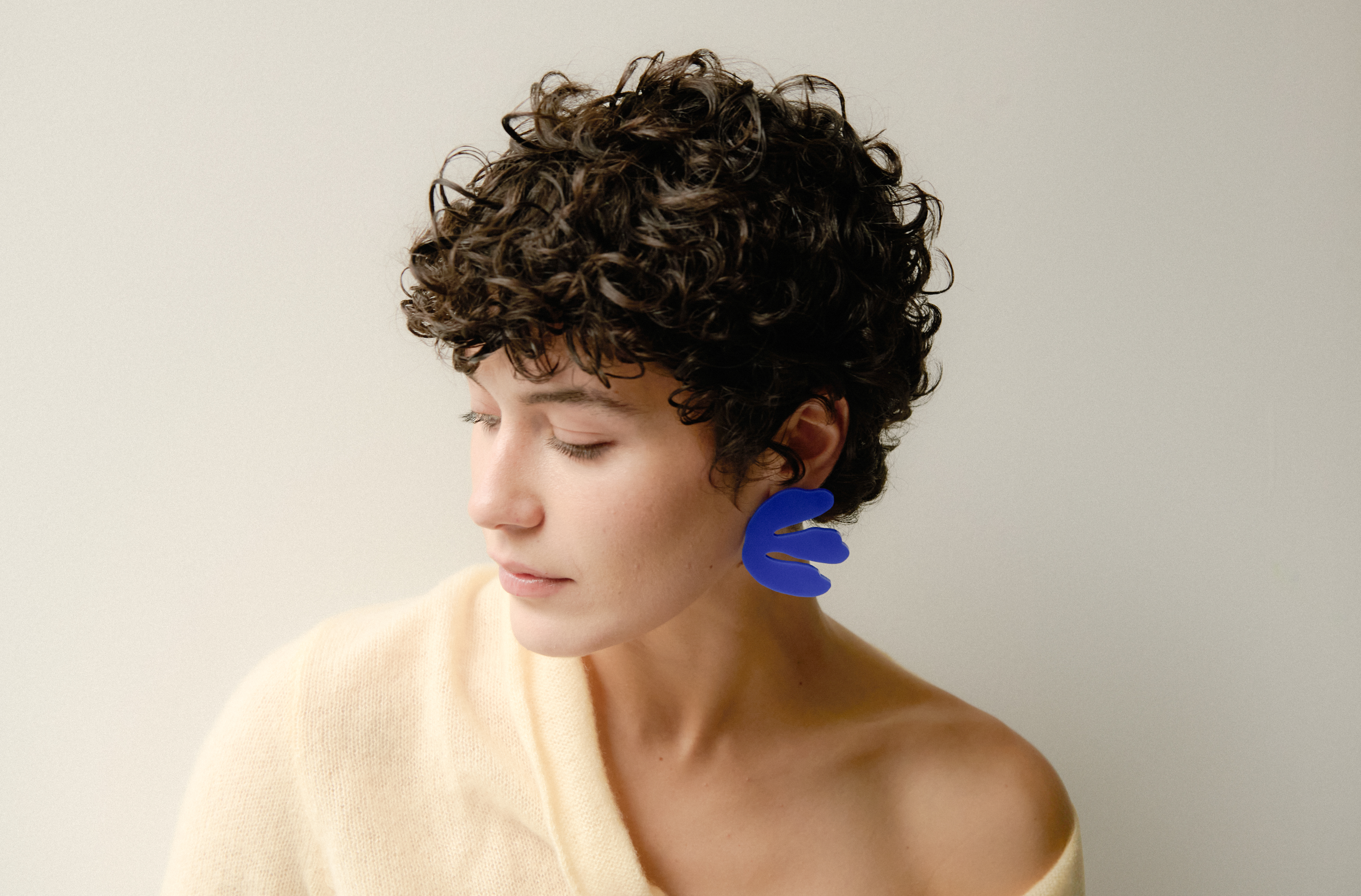 model wearing lasercut jewelry by Capulet and Montague